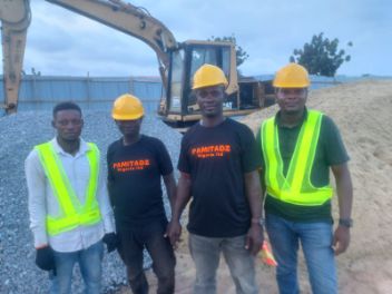 Pamitadz team during a site visit, wearing branded shirts and safety vests