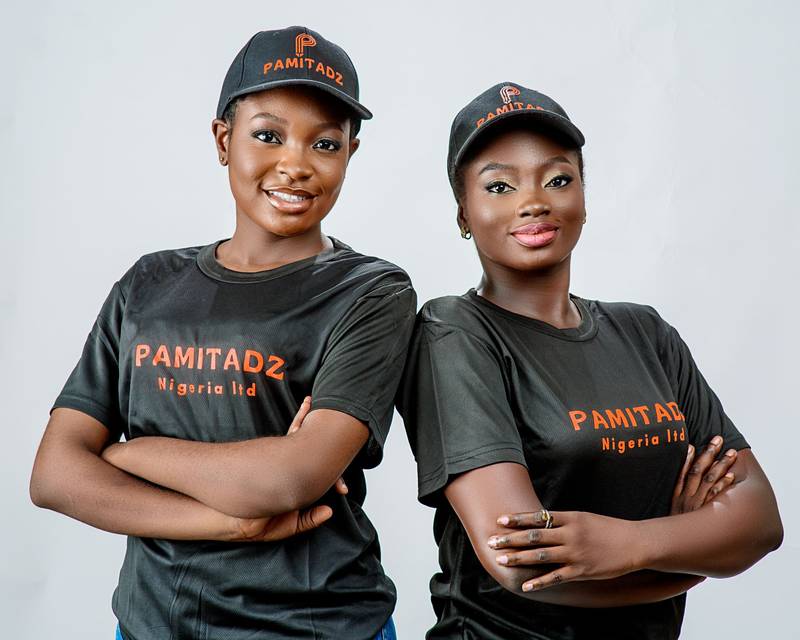 Two Pamitadz team members in company caps and shirts